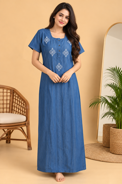 Woman wearing a light blue cotton denim nighty with white embroidery, short sleeves and maxi length – Jammies Haven