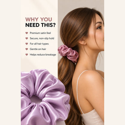 Woman wearing a black scrunchie while styling her hair