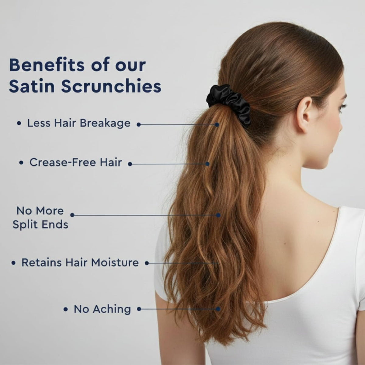 Woman wearing a black slim scrunchie in a ponytail