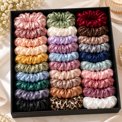 Pack of 24 multicolor satin-look hair scrunchies arranged in a display box